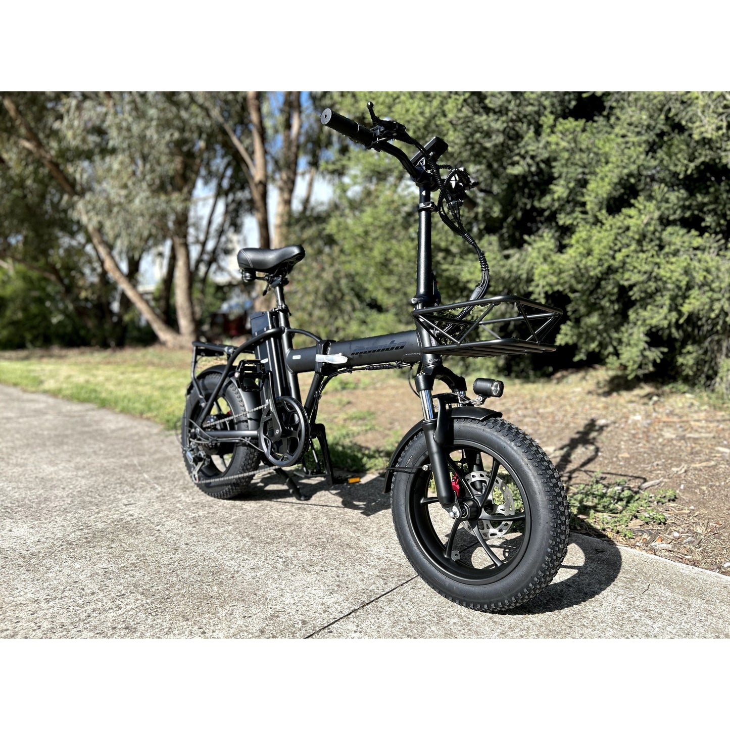 mamba mini ebike parked near trees