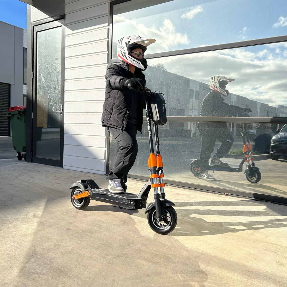 a person on his all terrain X1 electric scooter 