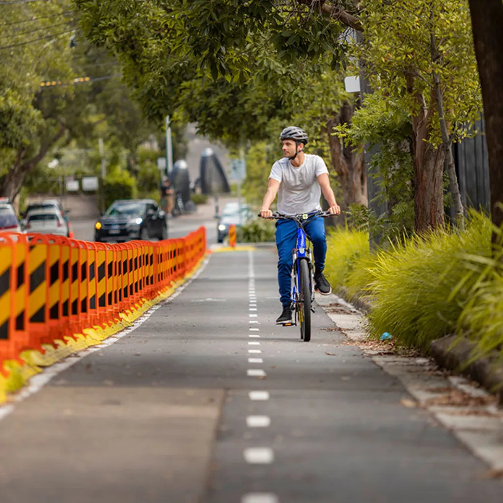 a person riding his valk vortex 3 in a bike lane in australia