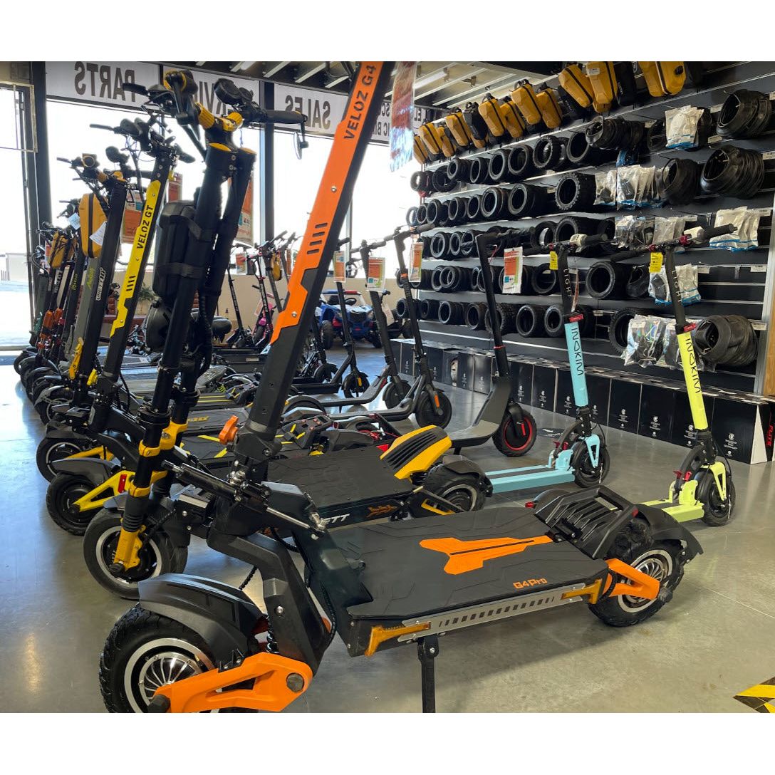 line of veloz electric scooters in the veloz showroom